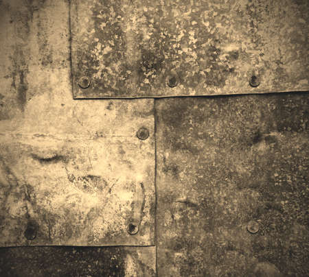 metal sheets fastened with rivets. texture, background. old, retro. black and white photo.の写真素材