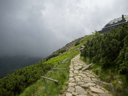 Landscape. View on mountain path and heavy clouds near Szrenica shelter in Great Mountains. Karkonosze.の写真素材