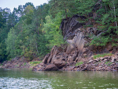 Gneiss metamorphic rocks on Kwisa riverbank. View from deeply cut river valley near LeÅna town.の写真素材
