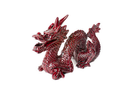 Brown traditional chinese dragon isolated on white background. Feng Shui statuette.の写真素材