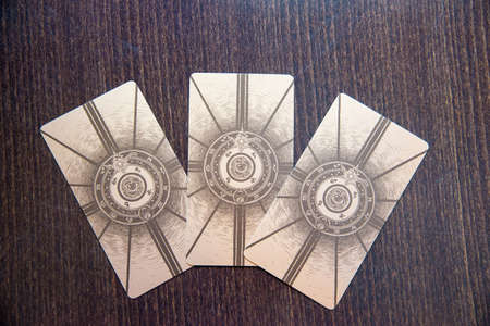 Tarot cards on the wood. Labirinth tarot deck. Esoteric background.のeditorial素材