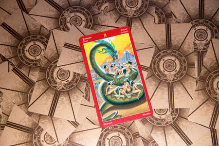 Tarot card Eight of Pentacles. Dragon tarot deck. Esoteric background.