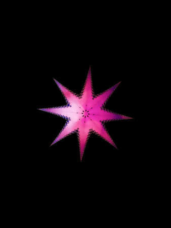 Pink glowing star on a black backgroundの写真素材