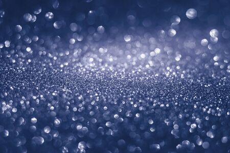 Abstract blurred bokeh lights background. Photograph of out of focus points of light.の写真素材