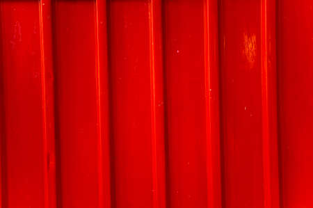 A pattern of a red metal fence