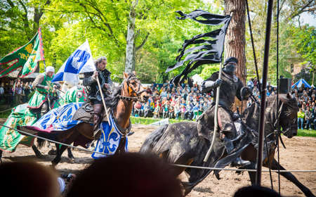 Satzvey, Germany, the 19th of May 2013 - Three horsemen with banners on the medieval festival in...