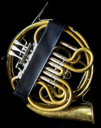 Golden french horn without a bell and mouthpiece  in the horn caseの写真素材