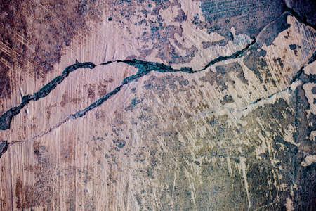 Texture of an old painted cracked wall. Colored in pink and blueの写真素材