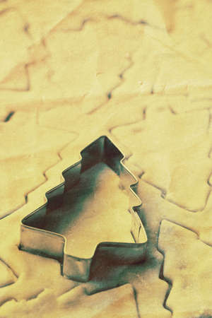 Christmas tree shaped cookie dough ready for bakingの写真素材