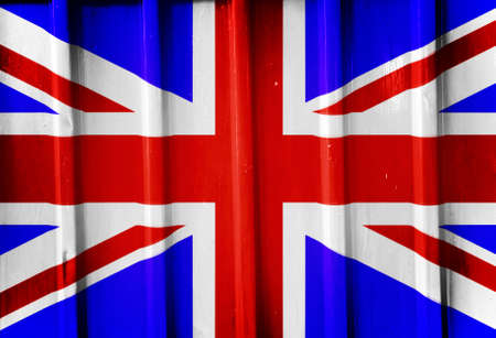 Grunge british flag background painted on the metal fenceの写真素材