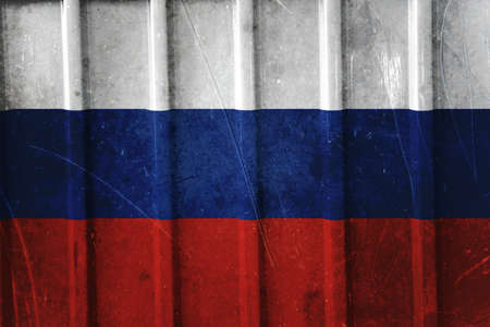 Grunge russian flag background painted on the metal fenceの写真素材