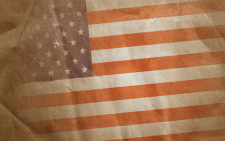 Vintage bent faded paper american flag at angleの写真素材