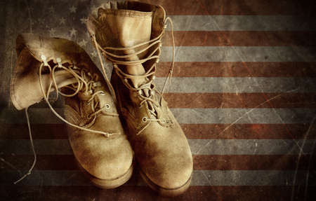 US Army boots on the vintage textured paper flag backgroundの写真素材