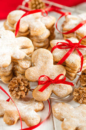 Christmas gingerbread cookie man with red ribbon tieの写真素材