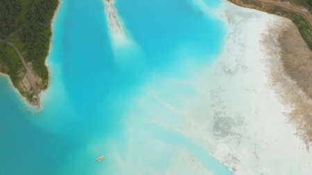 Artificial lake for discharging chemical waste from a chemical plant. Environmental pollution. Ecological catastrophy. Aerial shot . Beautiful view.の写真素材