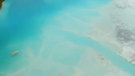 Artificial lake for discharging chemical waste from a chemical plant. Environmental pollution. Ecological catastrophy. Aerial shot . Beautiful view.の写真素材