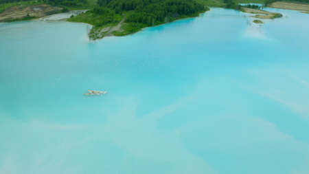 Artificial lake for discharging chemical waste from a chemical plant. Environmental pollution. Ecological catastrophy. Aerial shot . Beautiful view.の写真素材
