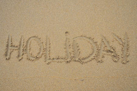 The written word  holiday in the beach sand.の写真素材