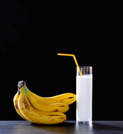Banana juice on a black background の写真素材
