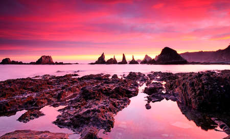 Sunrise on Gueirua beach in Asturias, Spain 