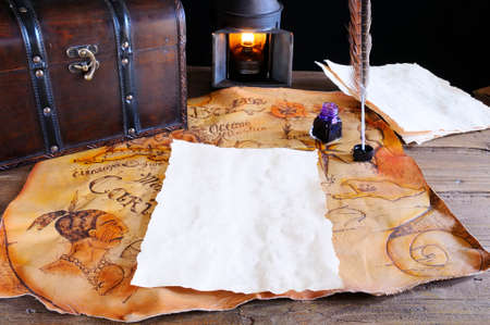 Work desk with parchment and old map の写真素材