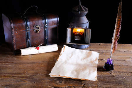 Work desk with parchment,  inkwell and pen の写真素材