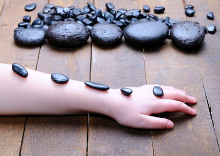 Volcanic hot stones for massage in woman body の写真素材