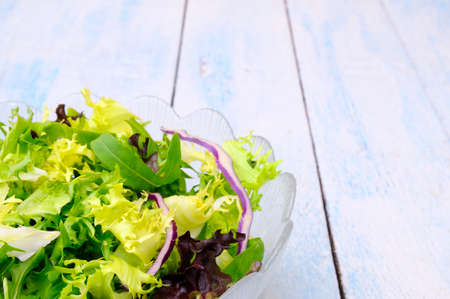 Fresh lettuce on a blue kitchen table.の写真素材