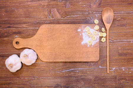 Cutting board wooden with tortellini on kitchen table.の写真素材