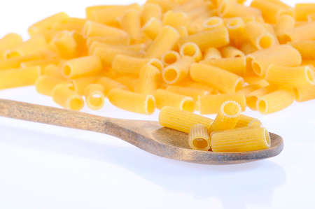 Isolated macaroni raw on a white background.