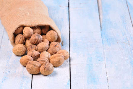 Walnuts on wooden table in the kitchen.の写真素材