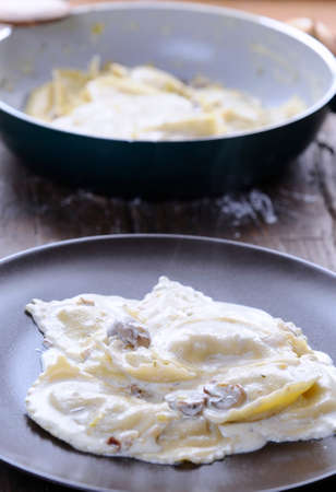 Preparing fresh ravioli at the kitchen table.の写真素材