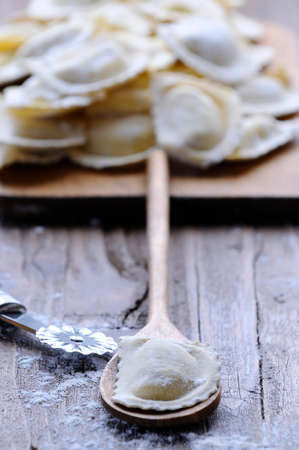 Preparing fresh ravioli at the kitchen table.の写真素材