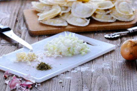 Preparing fresh ravioli at the kitchen table.の写真素材