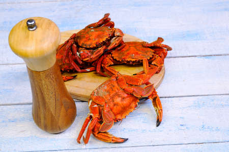 Velvet crabs for cooking on wooden table in the kitchenの写真素材