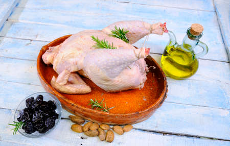 Turkey prepared on the wooden table in the kitchen.の写真素材