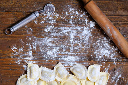 Preparing fresh ravioli at the kitchen table.の写真素材