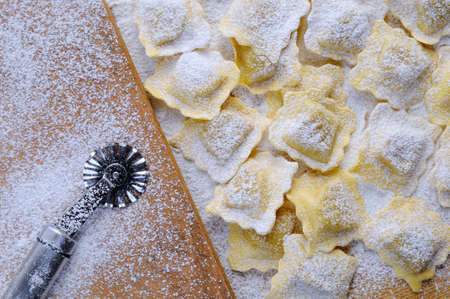 Preparing fresh ravioli at the kitchen table.の写真素材