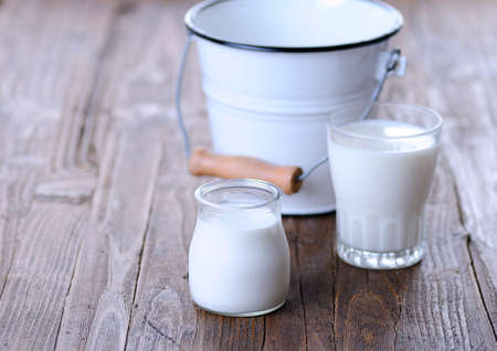 Homemade yogurt on wooden table in the kitchenの写真素材