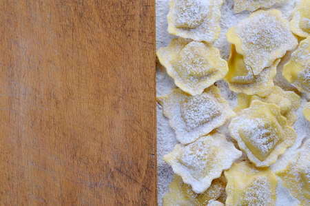 Preparing fresh ravioli at the kitchen table.の写真素材