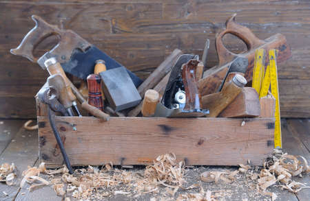 Old toolbox on the workbench in a carpentry