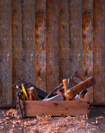 Old toolbox on the workbench in a carpentryの写真素材