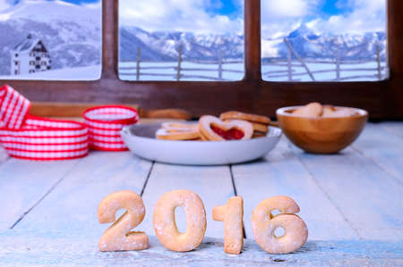 2016 homemade cookies on wooden table in the kitchen