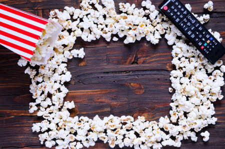 Freshly made popcorn on a wooden tableの写真素材