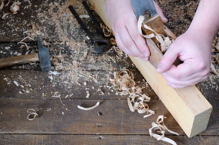 Carpenter working wood on the workbench carpentry.の写真素材