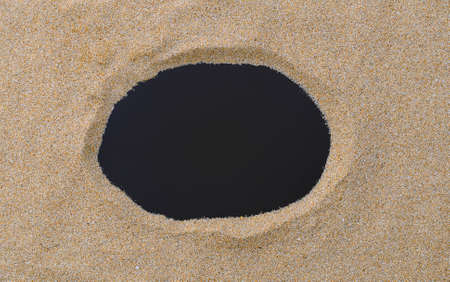 Blackboard with copy space on beach sand.の写真素材