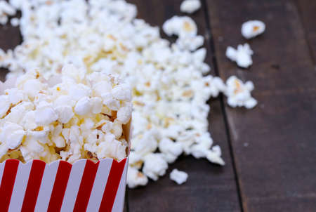 Freshly made popcorn on a wooden tableの写真素材