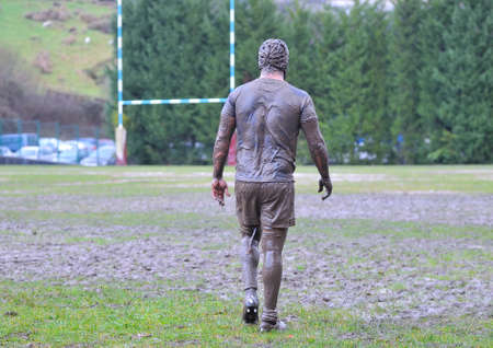 Detail muddy boots in a rugby match.の写真素材