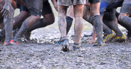Detail muddy boots in a rugby match.の写真素材