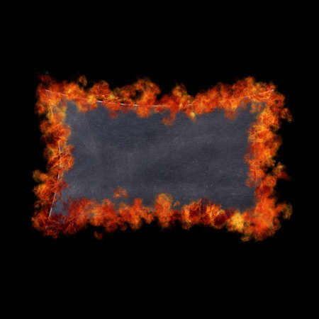 A blackboard in flames on black background.の写真素材